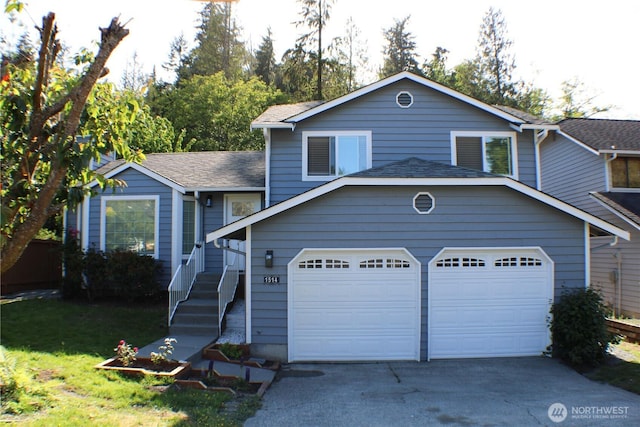 1514 51st Pl SW, Everett, WA 98203 - split level home with an attached garage, driveway, and roof with shingles