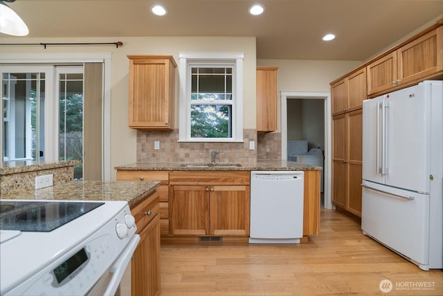 2605 Fir Crest Blvd, Anacortes, WA 98221 - kitchen with white appliances, light wood-style flooring, decorative backsplash, recessed lighting, and light stone counters
