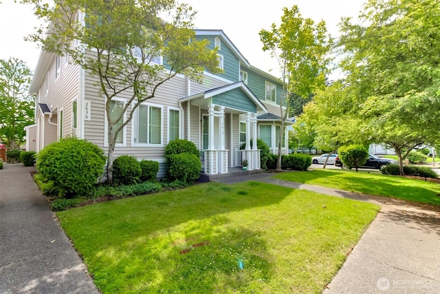 2630 Hamilton Ave, Dupont, WA 98327 - view of front of house featuring covered porch and a front yard