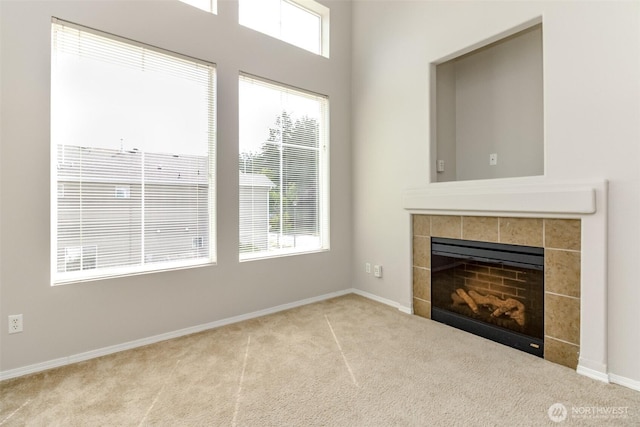 2630 Hamilton Ave, Dupont, WA 98327 - unfurnished living room with carpet floors and a tiled fireplace