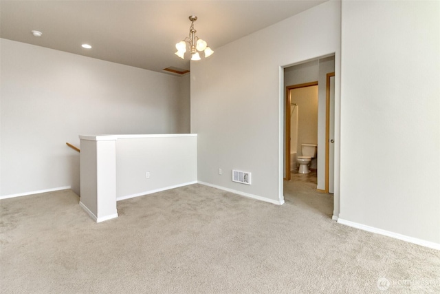 2630 Hamilton Ave, Dupont, WA 98327 - empty room featuring a chandelier and carpet