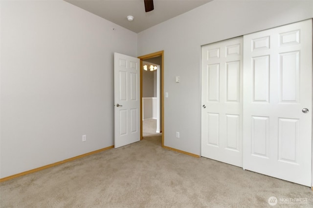 2630 Hamilton Ave, Dupont, WA 98327 - unfurnished bedroom featuring light colored carpet, a closet, and a ceiling fan