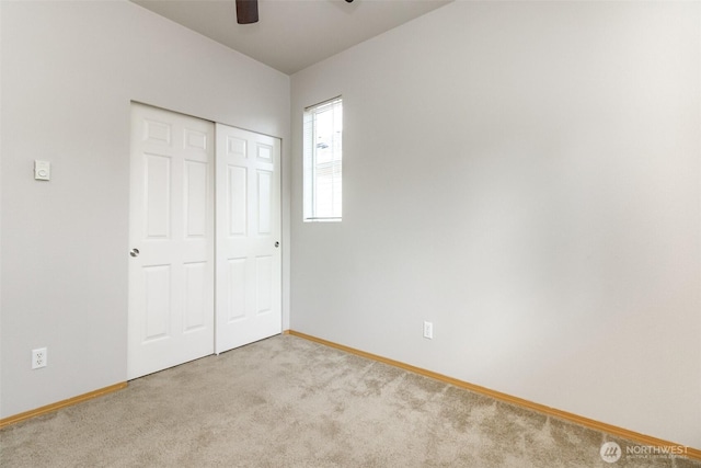 2630 Hamilton Ave, Dupont, WA 98327 - unfurnished bedroom featuring carpet floors, a closet, and a ceiling fan