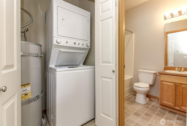 2630 Hamilton Ave, Dupont, WA 98327 - washroom with stacked washer and clothes dryer and water heater