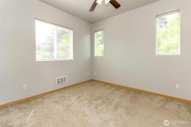 2630 Hamilton Ave, Dupont, WA 98327 - spare room featuring light colored carpet and a ceiling fan