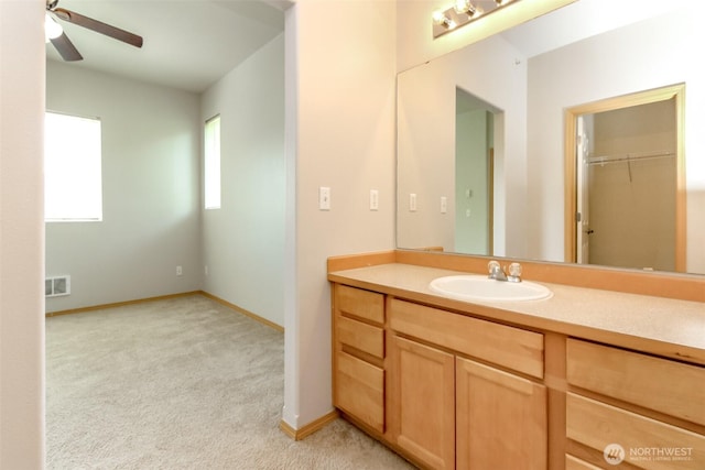 2630 Hamilton Ave, Dupont, WA 98327 - bathroom with vanity, ceiling fan, and a walk in closet