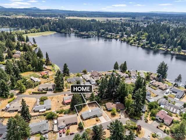 7331 Ridgemont Dr SE, Olympia, WA 98513 - aerial view of residential area with property parcel outlined and a large body of water