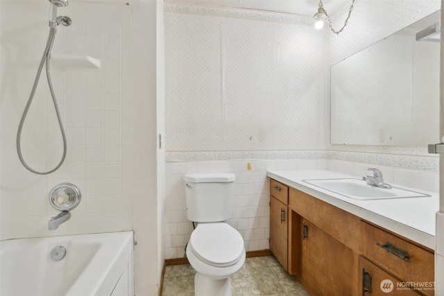 7331 Ridgemont Dr SE, Olympia, WA 98513 - full bathroom featuring vanity, wainscoting, wallpapered walls, shower / bathtub combination, and tile walls