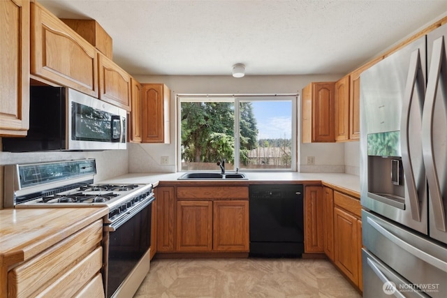 7331 Ridgemont Dr SE, Olympia, WA 98513 - kitchen featuring appliances with stainless steel finishes and light countertops