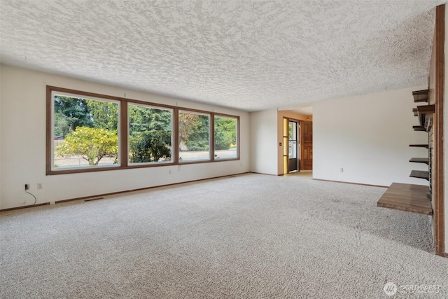 7331 Ridgemont Dr SE, Olympia, WA 98513 - unfurnished living room featuring a textured ceiling, carpet floors, and healthy amount of natural light
