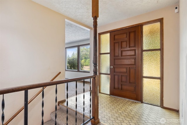 7331 Ridgemont Dr SE, Olympia, WA 98513 - entrance foyer with a textured ceiling and baseboards