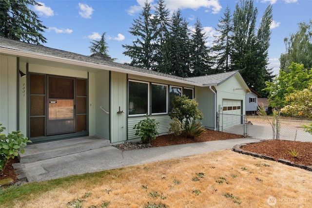 7331 Ridgemont Dr SE, Olympia, WA 98513 - view of front of property featuring a garage, concrete driveway, a gate, and roof with shingles