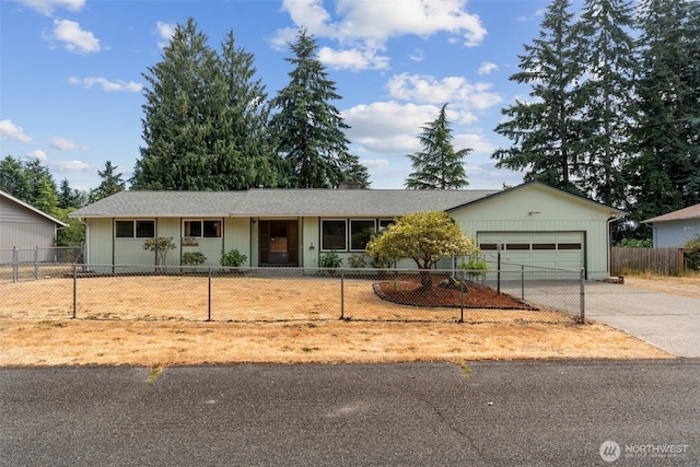 7331 Ridgemont Dr SE, Olympia, WA 98513 - ranch-style home featuring concrete driveway, an attached garage, and a fenced front yard
