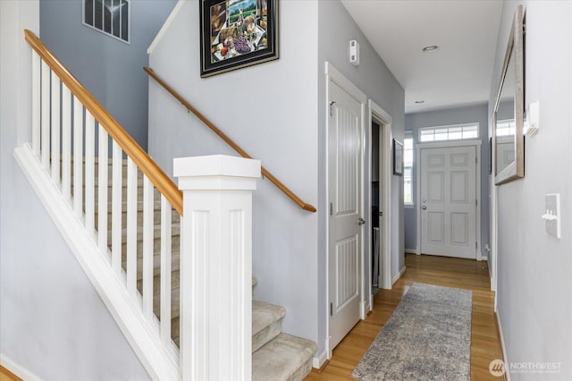 1404 Portside Ct, Freeland, WA 98249 - foyer entrance with stairway and light wood-style floors