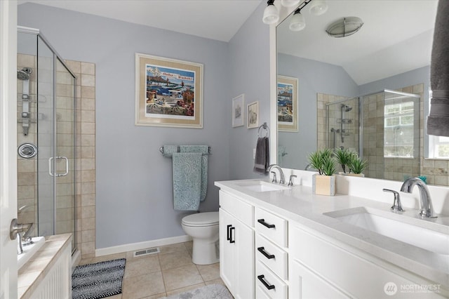 1404 Portside Ct, Freeland, WA 98249 - bathroom with a stall shower, tile patterned flooring, double vanity, and vaulted ceiling