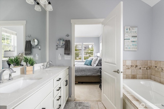 1404 Portside Ct, Freeland, WA 98249 - ensuite bathroom with double vanity, a bath, plenty of natural light, and tile patterned floors
