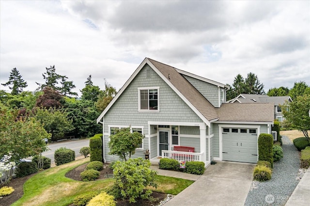 1404 Portside Ct, Freeland, WA 98249 - view of front of property with a porch, an attached garage, and concrete driveway