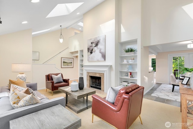 11404 NE 103rd St, Kirkland, WA 98033 - living room featuring high vaulted ceiling, a skylight, a high end fireplace, recessed lighting, and built in shelves