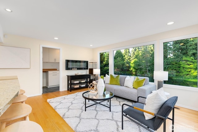 11404 NE 103rd St, Kirkland, WA 98033 - living room with healthy amount of natural light, light wood-type flooring, and recessed lighting