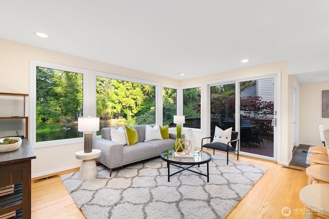 11404 NE 103rd St, Kirkland, WA 98033 - living room with plenty of natural light, wood finished floors, and recessed lighting