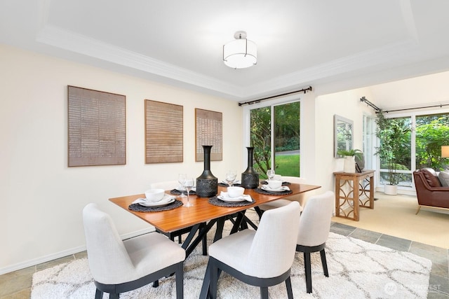 11404 NE 103rd St, Kirkland, WA 98033 - dining room featuring healthy amount of natural light, crown molding, a tray ceiling, and light stone finish flooring