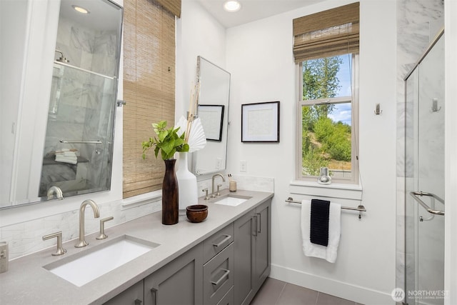 11530 117th Ln NE Unit 2, Kirkland, WA 98034 - bathroom with a marble finish shower, double vanity, backsplash, tile patterned floors, and recessed lighting