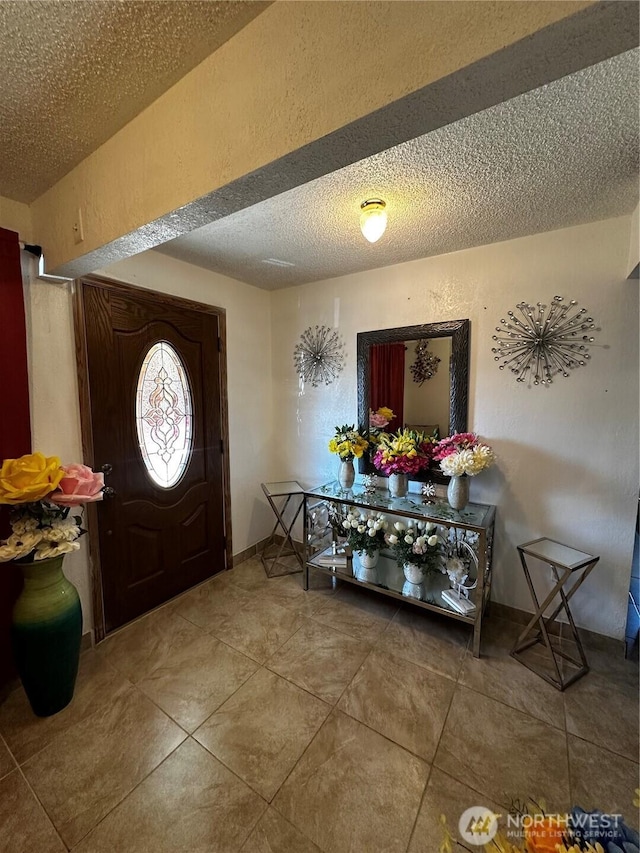 438 Biggs Dr, Moses Lake, WA 98837 - entrance foyer featuring a textured ceiling, a textured wall, and tile patterned floors