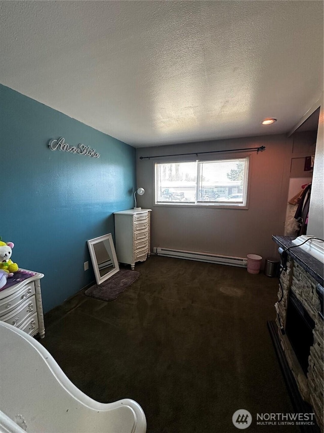 438 Biggs Dr, Moses Lake, WA 98837 - carpeted bedroom with a baseboard heating unit and a textured ceiling
