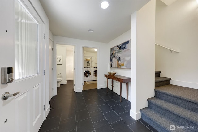 228 24th Ave E Unit A, Seattle, WA 98112 - foyer with washer and dryer, dark tile patterned flooring, stairway, and recessed lighting