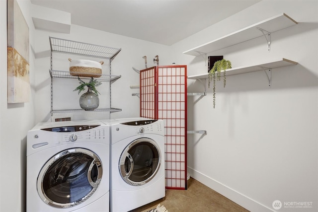 228 24th Ave E Unit A, Seattle, WA 98112 - laundry area with washing machine and dryer and baseboards