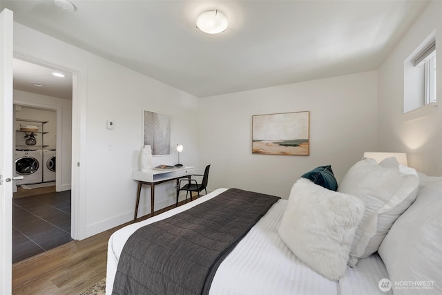 228 24th Ave E Unit A, Seattle, WA 98112 - bedroom with washing machine and dryer and wood finished floors