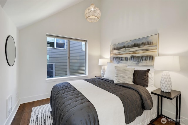 228 24th Ave E Unit A, Seattle, WA 98112 - bedroom featuring lofted ceiling and wood finished floors