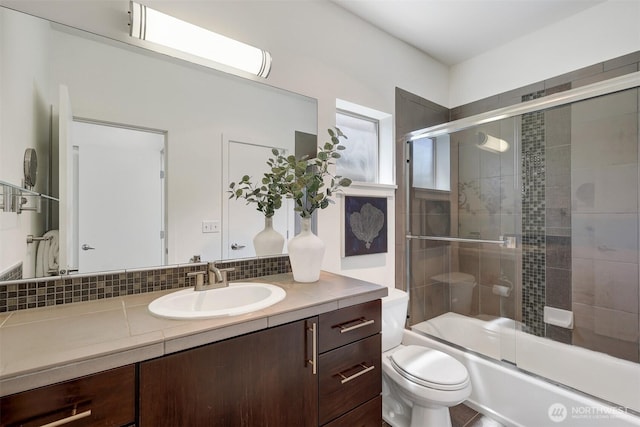 228 24th Ave E Unit A, Seattle, WA 98112 - full bathroom with vanity, combined bath / shower with glass door, and tasteful backsplash