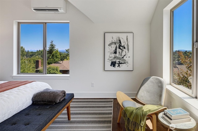 228 24th Ave E Unit A, Seattle, WA 98112 - bedroom featuring a wall unit AC and baseboards