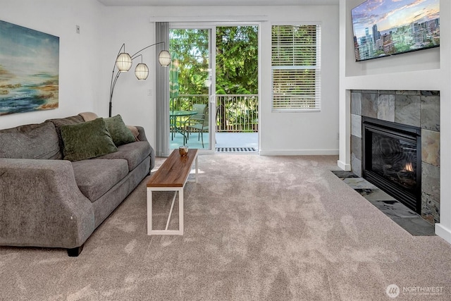 15325 SE 155th Pl Unit Q2, Renton, WA 98058 - carpeted living area with a tiled fireplace and baseboards