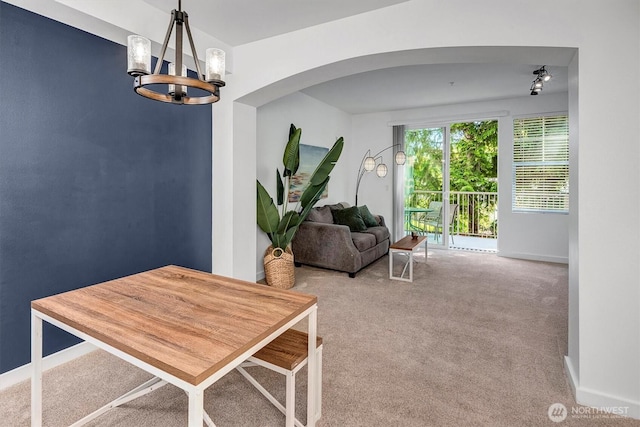 15325 SE 155th Pl Unit Q2, Renton, WA 98058 - carpeted dining space with a chandelier and arched walkways