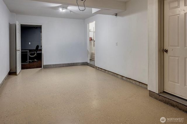 15325 SE 155th Pl Unit Q2, Renton, WA 98058 - garage featuring a desk and baseboards