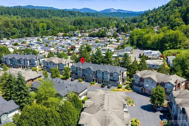 15325 SE 155th Pl Unit Q2, Renton, WA 98058 - aerial view of residential area featuring a heavily wooded area and mountains