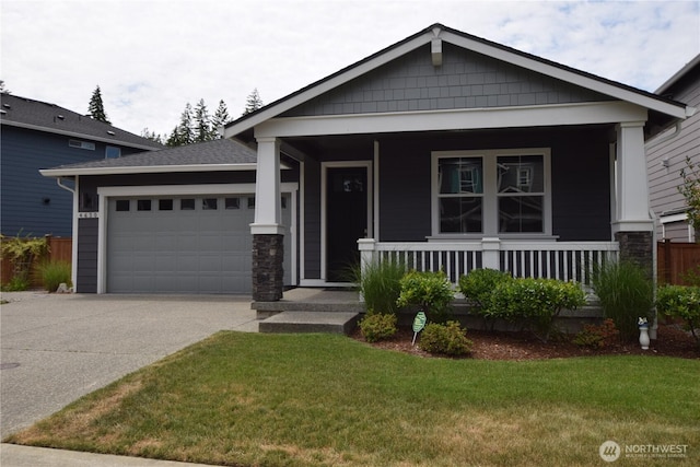 4650 Viridian Ave SW, Port Orchard, WA 98367 - view of front facade featuring a garage, driveway, a porch, and a front lawn