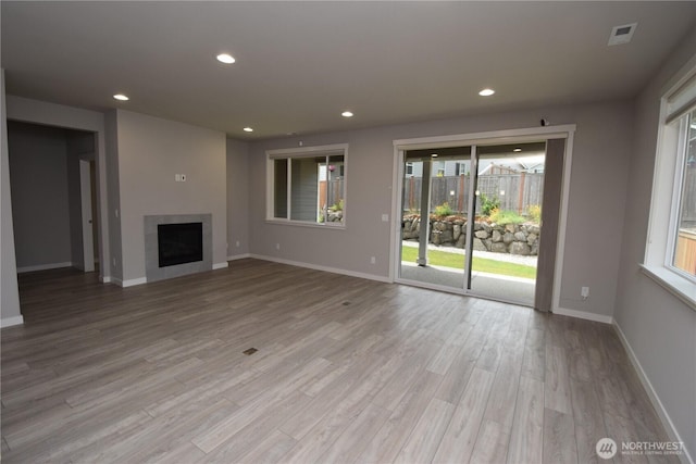 4650 Viridian Ave SW, Port Orchard, WA 98367 - unfurnished living room with wood finished floors, recessed lighting, and a fireplace