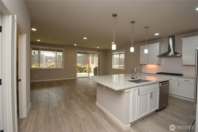 4650 Viridian Ave SW, Port Orchard, WA 98367 - kitchen with wall chimney exhaust hood, light wood-style flooring, tasteful backsplash, healthy amount of natural light, and recessed lighting