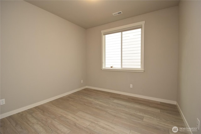 4650 Viridian Ave SW, Port Orchard, WA 98367 - spare room featuring light wood-type flooring and baseboards