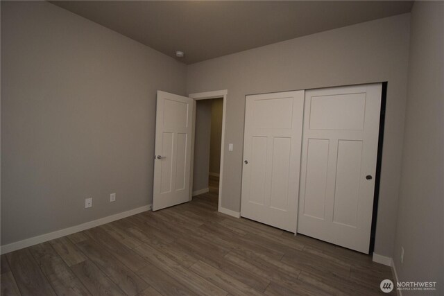 4650 Viridian Ave SW, Port Orchard, WA 98367 - unfurnished bedroom with wood finished floors and a closet
