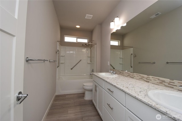 4650 Viridian Ave SW, Port Orchard, WA 98367 - full bathroom with double vanity, shower / bathtub combination, wood finished floors, and recessed lighting