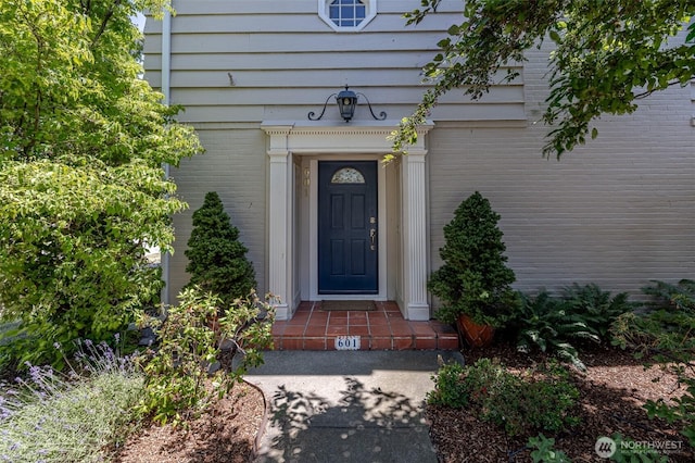601 Yakima St, Wenatchee, WA 98801 - doorway to property featuring brick siding