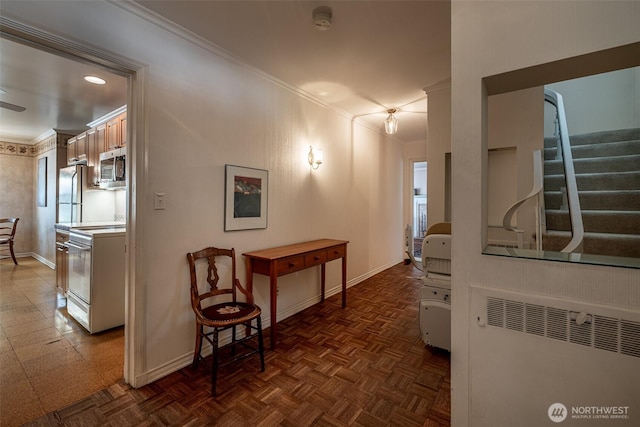 601 Yakima St, Wenatchee, WA 98801 - hall featuring ornamental molding, radiator heating unit, and stairway