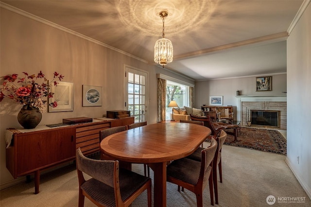 601 Yakima St, Wenatchee, WA 98801 - dining space with light carpet, ornamental molding, a chandelier, and a glass covered fireplace
