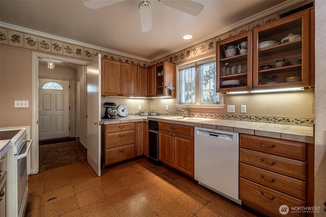 601 Yakima St, Wenatchee, WA 98801 - kitchen featuring white appliances, a ceiling fan, ornamental molding, glass insert cabinets, and brown cabinetry