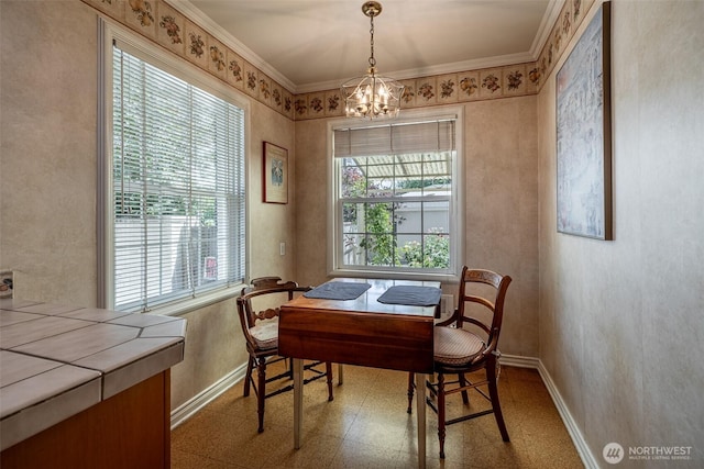 601 Yakima St, Wenatchee, WA 98801 - dining room featuring healthy amount of natural light, a chandelier, crown molding, and tile patterned floors