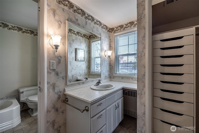 601 Yakima St, Wenatchee, WA 98801 - bathroom featuring vanity and radiator heating unit